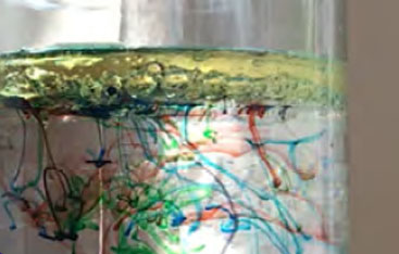 Coloured swirls in a jar of liquid.