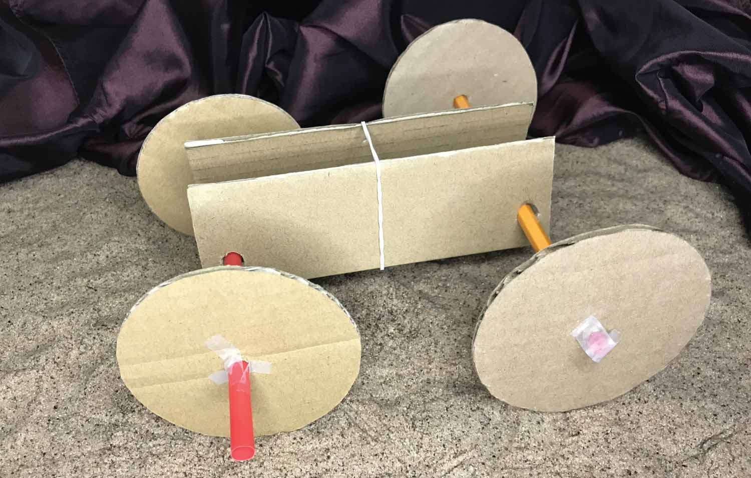 Side view of a completed cardboard rover.
